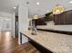 Elegant kitchen with a large island, granite countertops, and stainless steel appliances at 9582 Creighton Nw Rd, Concord, NC 28027