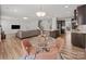 Bright, open-concept living space featuring an island kitchen and a cozy dining area at 9582 Creighton Nw Rd, Concord, NC 28027