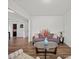 Cozy living room featuring hardwood floors, neutral decor, and an open layout perfect for entertaining at 9582 Creighton Nw Rd, Concord, NC 28027