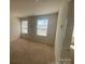 Empty bedroom with two windows allowing for abundant natural light at 104 Mulligan Dr, Shelby, NC 28150