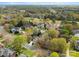 A charming neighborhood with manicured lawns, tree-lined streets, and a golf course and pond nearby at 10809 Wicklow Brook Ct, Charlotte, NC 28277