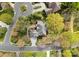 A well-maintained home is nestled among mature trees on a quiet street with circular driveways at 10809 Wicklow Brook Ct, Charlotte, NC 28277