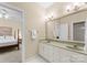 Bathroom featuring double sinks and access to the main bedroom at 10809 Wicklow Brook Ct, Charlotte, NC 28277