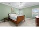 Bedroom with a four poster bed, light green walls, and natural light at 10809 Wicklow Brook Ct, Charlotte, NC 28277