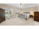 Serene bedroom with ample natural light, neutral decor, and classic furniture creating a relaxing atmosphere at 10809 Wicklow Brook Ct, Charlotte, NC 28277