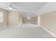 Spacious bonus room with neutral walls, carpet, and lots of natural light at 10809 Wicklow Brook Ct, Charlotte, NC 28277