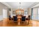 Formal dining room features hardwood floors, chandelier, and classic furnishings at 10809 Wicklow Brook Ct, Charlotte, NC 28277