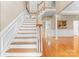 Open foyer with a hardwood staircase and gleaming wood floors at 10809 Wicklow Brook Ct, Charlotte, NC 28277