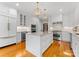Modern kitchen with an island, stainless steel appliances, and bright lighting, perfect for culinary enthusiasts at 10809 Wicklow Brook Ct, Charlotte, NC 28277