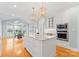 Contemporary kitchen with an island, stainless steel appliances, pendant lights, and an adjacent dining area at 10809 Wicklow Brook Ct, Charlotte, NC 28277