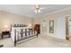 A cozy main bedroom featuring a decorative iron bed frame and neutral decor at 10809 Wicklow Brook Ct, Charlotte, NC 28277