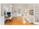 Charming office with hardwood floors, built-in shelving, and French doors at 10809 Wicklow Brook Ct, Charlotte, NC 28277