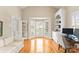 Cozy office with a bright bay window, hardwood flooring, and a cream colored couch at 10809 Wicklow Brook Ct, Charlotte, NC 28277