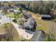 A high-angle shot reveals a home with an extended driveway, set among trees and a well-maintained yard at 1104 Crestview Dr, Salisbury, NC 28146