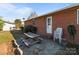Backyard of the home with a patio area featuring a wooden picnic table at 1104 Crestview Dr, Salisbury, NC 28146