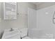Well-maintained bathroom features a tub-shower combo and vanity with a mirror, providing essential amenities at 1104 Crestview Dr, Salisbury, NC 28146