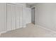 Bedroom featuring carpet, a closet with bifold doors, and freshly painted walls, ready for occupancy at 1104 Crestview Dr, Salisbury, NC 28146