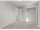 This simple bedroom has neutral walls, carpet, and a closet, perfect for relaxation at 1104 Crestview Dr, Salisbury, NC 28146