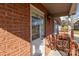 Welcoming brick home featuring a front door with glass and adjacent wooden deck at 1104 Crestview Dr, Salisbury, NC 28146