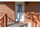 Charming front porch and white door framed by brick and stained wood at 1104 Crestview Dr, Salisbury, NC 28146