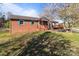 Well-maintained home featuring colorful shutters and a sprawling green lawn at 1104 Crestview Dr, Salisbury, NC 28146