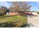 Charming home with a detached garage and flourishing flowering tree in yard at 1104 Crestview Dr, Salisbury, NC 28146