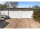 Two-car garage with white doors and adjacent to well manicured greenery at 1104 Crestview Dr, Salisbury, NC 28146