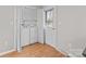 Bright laundry room with washer, dryer, storage cabinets, and exterior access; convenient and functional at 1104 Crestview Dr, Salisbury, NC 28146