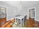 Elegant dining room with hardwood floors, a chandelier, and classic trim detail at 1114 Herrin Ave, Charlotte, NC 28205
