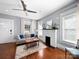 Comfortable living room boasts hardwood floors, a decorative fireplace, and plenty of natural light at 1114 Herrin Ave, Charlotte, NC 28205