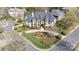 Aerial view of a grand home showing landscaping, circular driveway, and beautiful lawn at 11236 Mcclure Manor Dr, Charlotte, NC 28277