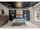 This bedroom is decorated with a galaxy mural, accent wall, and soft carpet at 11236 Mcclure Manor Dr, Charlotte, NC 28277
