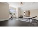 Home gym features rubber flooring, exercise machines, and a mirrored wall for workouts at 11236 Mcclure Manor Dr, Charlotte, NC 28277