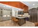 Spacious kitchen featuring an island, custom cabinets, and stone floors at 11236 Mcclure Manor Dr, Charlotte, NC 28277