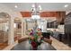 This beautiful kitchen has pendant lighting, an island, and an open floor plan looking into the living room at 11236 Mcclure Manor Dr, Charlotte, NC 28277