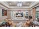 Spacious living room with decorative ceilings, chandelier, and open floor plan at 11236 Mcclure Manor Dr, Charlotte, NC 28277