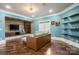 Comfortable living room featuring hardwood floors, custom built-ins, and recessed lighting at 11236 Mcclure Manor Dr, Charlotte, NC 28277