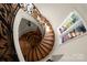 Unique spiral staircase with hardwood steps and custom wrought iron at 11236 Mcclure Manor Dr, Charlotte, NC 28277