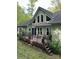 Spacious back deck with railing, perfect for outdoor dining and entertaining, with beautiful views of the surrounding greenery at 113 Duval Ct, Mooresville, NC 28117