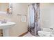 Bathroom featuring a single sink vanity, a bathtub with a shower and toilet at 113 Duval Ct, Mooresville, NC 28117