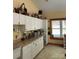 Bright craft room with white cabinets, a countertop workspace, and a large window at 113 Duval Ct, Mooresville, NC 28117