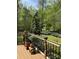 Relaxing deck area with potted plants and serene wooded views, a peaceful outdoor retreat at 113 Duval Ct, Mooresville, NC 28117
