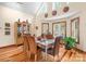 Bright dining room with hardwood floors, large windows, and stylish decor and furniture at 113 Duval Ct, Mooresville, NC 28117