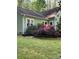 Well-maintained home with a lush lawn and mature landscaping, showcasing the property's beautiful outdoor space at 113 Duval Ct, Mooresville, NC 28117
