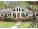 Inviting home with a red front door, large windows, and manicured landscaping, offering great curb appeal at 113 Duval Ct, Mooresville, NC 28117