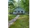 Inviting home with stone pathway and well-manicured lawn, offering a warm welcome and curb appeal at 113 Duval Ct, Mooresville, NC 28117