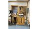 View of a spacious garage with woodworking tools, workbench, pegboard, drill press, and natural wood trim at 113 Duval Ct, Mooresville, NC 28117