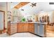 Spacious open kitchen with a stainless steel dishwasher and plenty of natural light at 113 Duval Ct, Mooresville, NC 28117