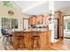 Inviting kitchen with wood cabinets, stainless steel appliances and an eat-in countertop bar area at 113 Duval Ct, Mooresville, NC 28117