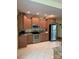 Well-lit kitchen featuring stainless steel appliances, ample cabinet space, and tile flooring at 113 Duval Ct, Mooresville, NC 28117